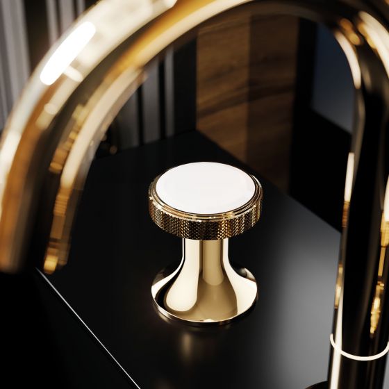 Close-up of the Valencia washbasin tap by Jörger in the exclusive finish sunshine with white crystal on a black background.